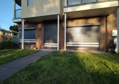 House front black shutters with white stripe